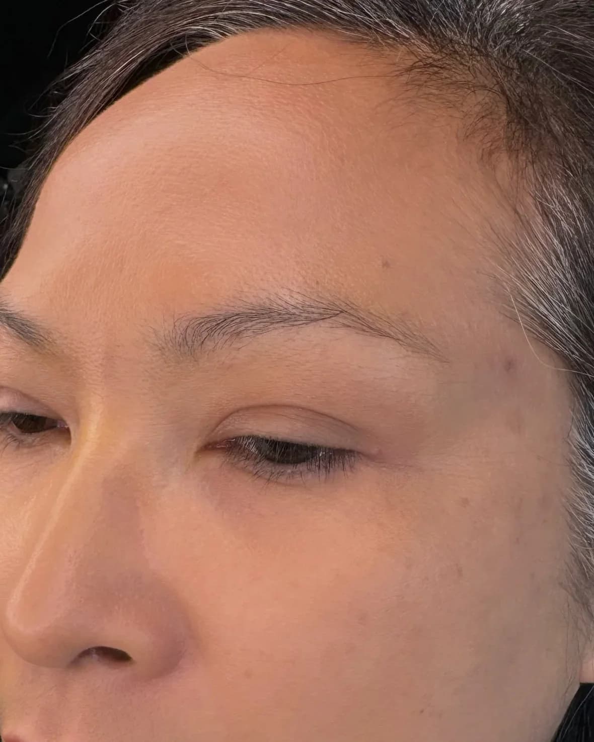 Client's sparse, faint natural brows before her appointment
