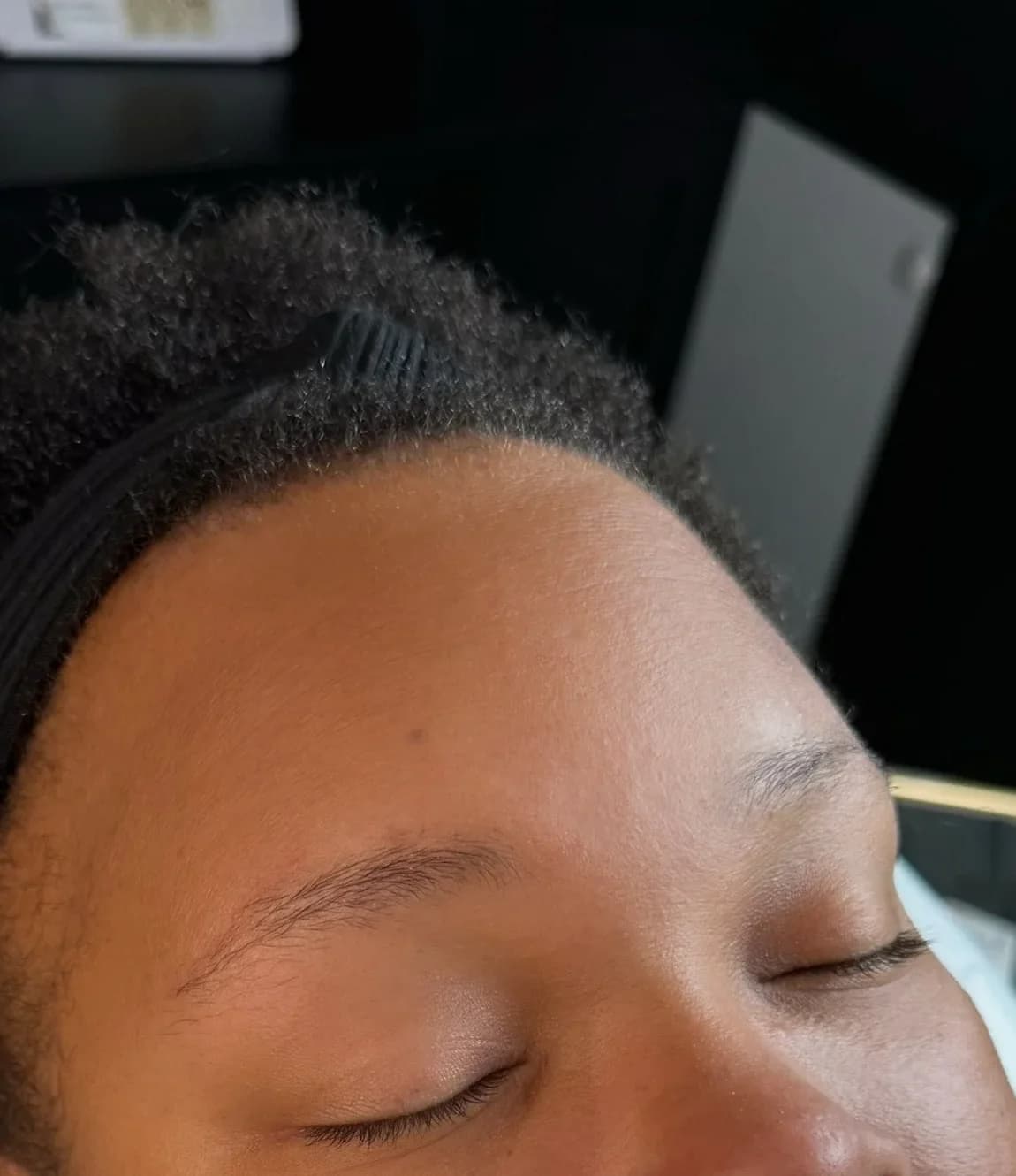 Client's thin, patchy natural brows before her appointment
