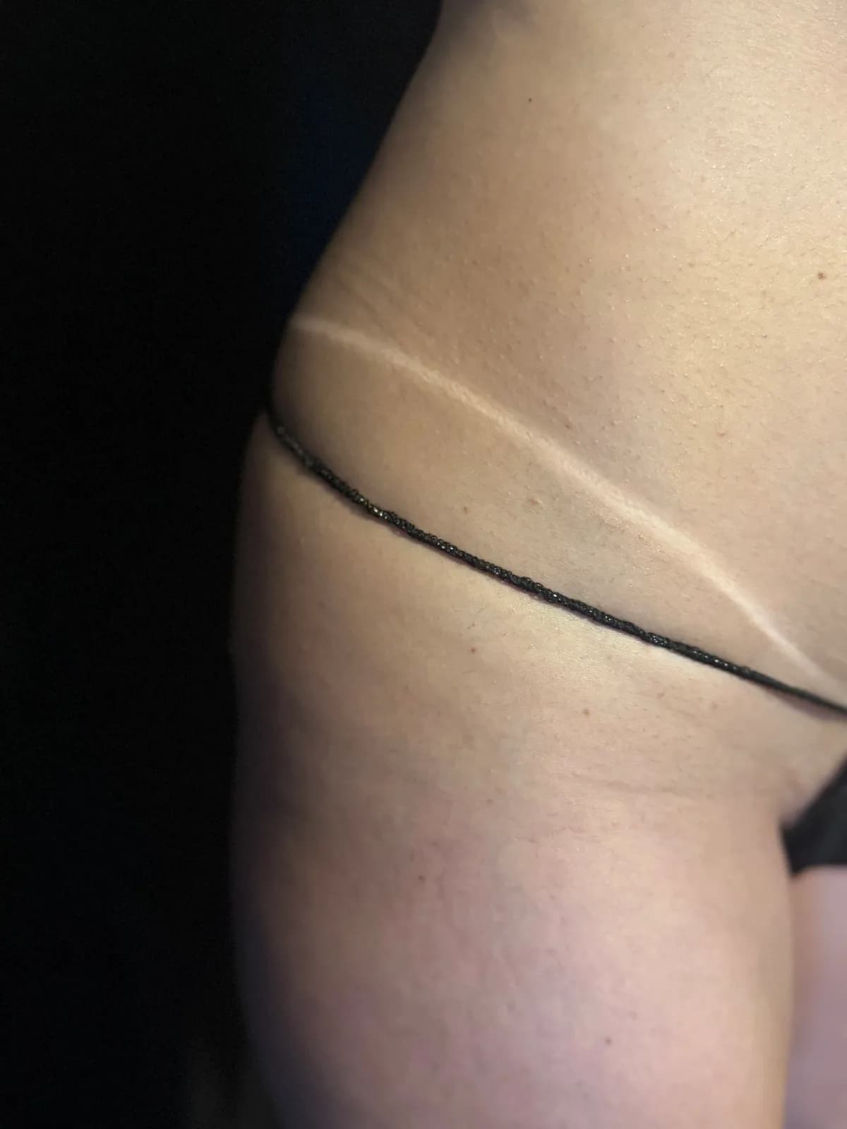 A fresh spray tan with a crisp tan line at the hip